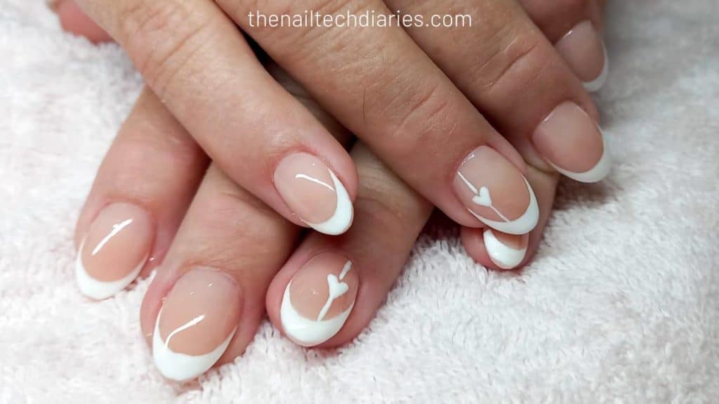 8. White heart simplistic nail art